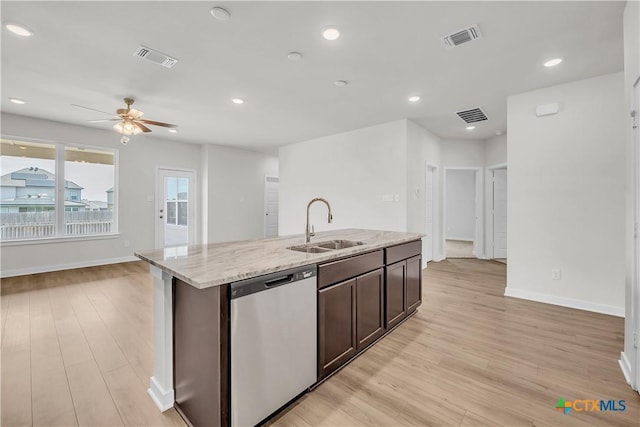 1531 Hillside Dr, Temple, TX 76502 - kitchen with stainless steel dishwasher, a sink, light wood-type flooring, baseboards, and recessed lighting
