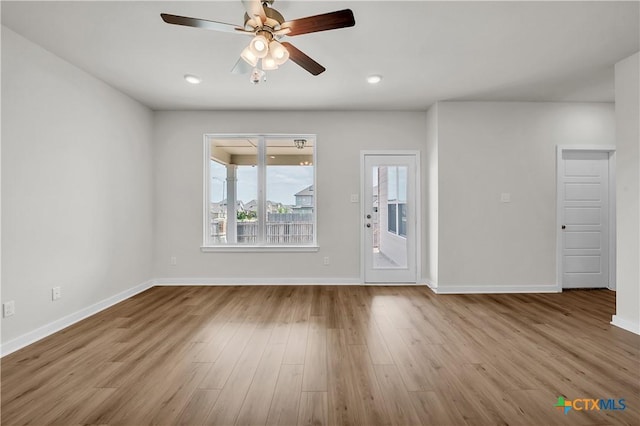 1531 Hillside Dr, Temple, TX 76502 - unfurnished living room with ceiling fan, wood finished floors, and baseboards