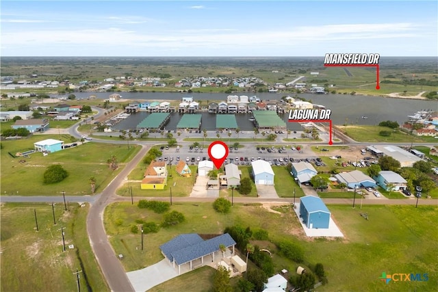 725 Baffin Dr, Port Mansfield, TX 78598 - aerial overview of property's location with a large body of water and nearby suburban area