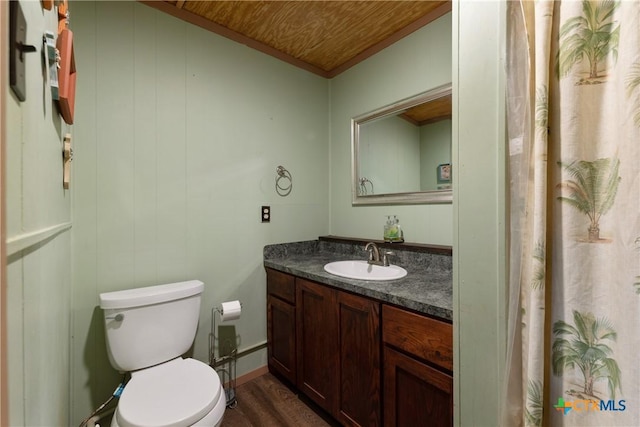 725 Baffin Dr, Port Mansfield, TX 78598 - full bath featuring vanity, toilet, wood finished floors, and crown molding