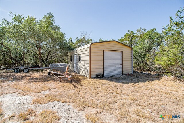 view of outdoor structure featuring a garage