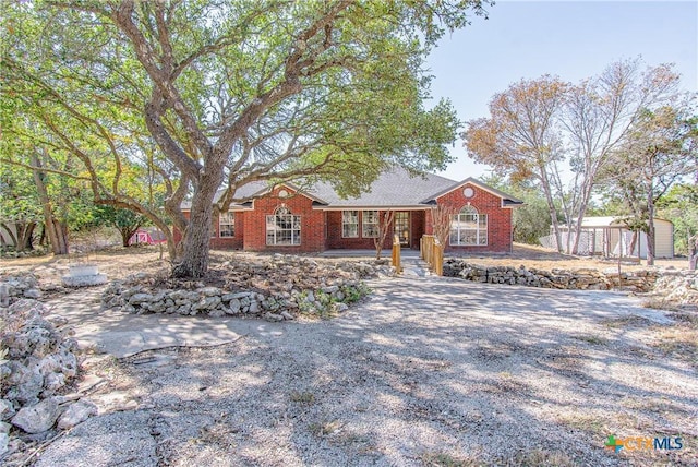 13989 Indian Bluff Rd, Temple, TX 76502 - ranch-style house featuring brick siding and an outdoor structure