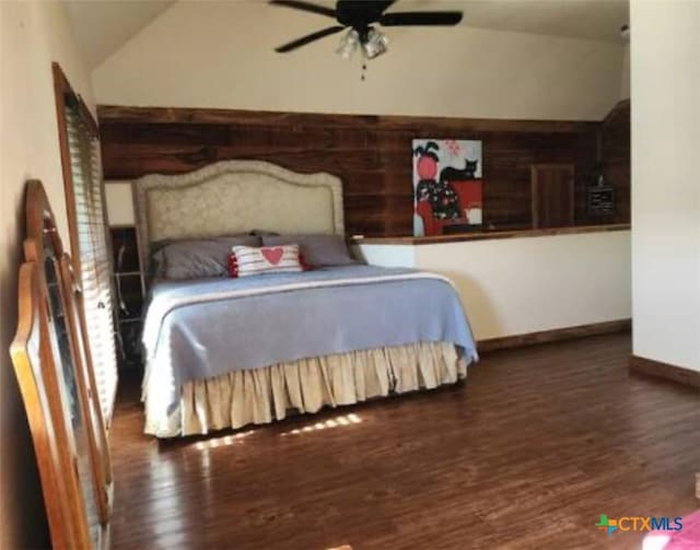 1123 N Beal St, Belton, TX 76513 - bedroom with wood finished floors, vaulted ceiling, and ceiling fan