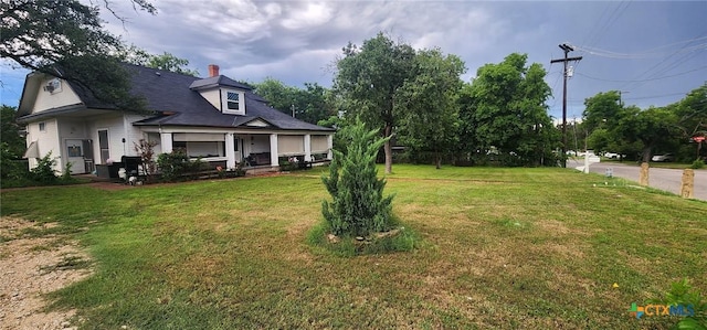 1123 N Beal St, Belton, TX 76513 - view of grassy yard featuring covered porch