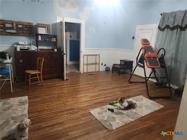1123 N Beal St, Belton, TX 76513 - interior space featuring wood finished floors and a wainscoted wall