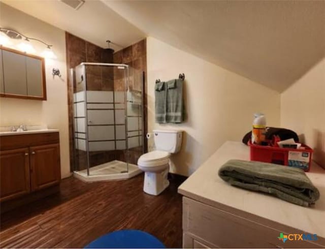 1123 N Beal St, Belton, TX 76513 - bathroom with lofted ceiling, a stall shower, vanity, and wood finished floors