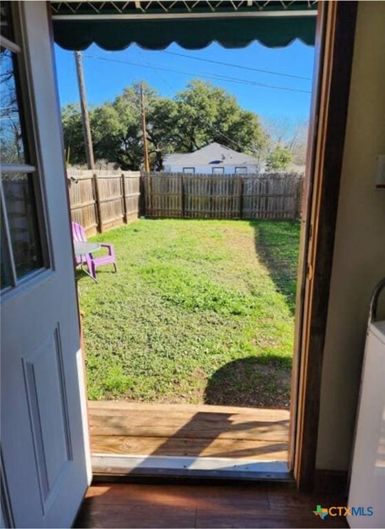 1123 N Beal St, Belton, TX 76513 - doorway featuring wood finished floors