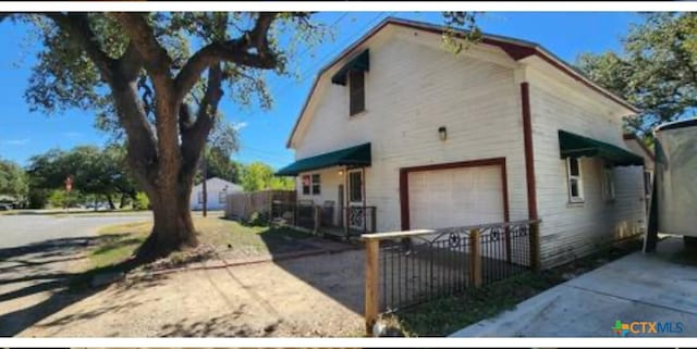 1123 N Beal St, Belton, TX 76513 - view of property exterior with a garage and driveway