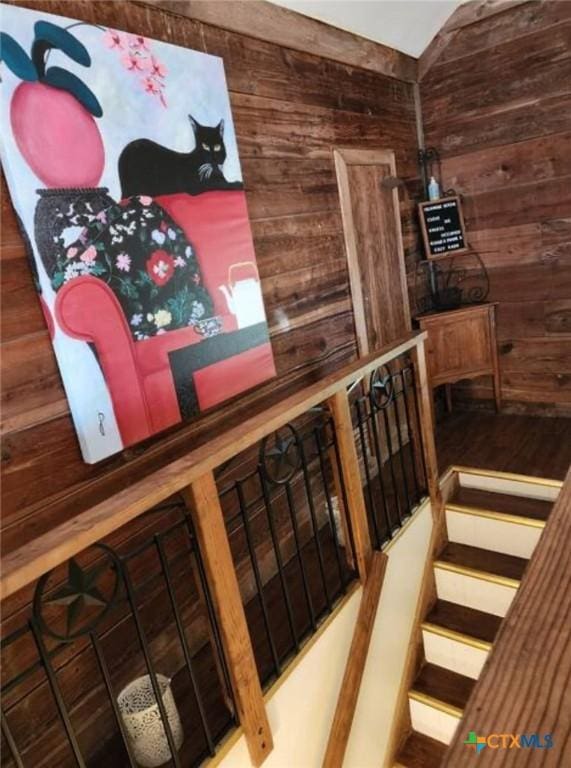 1123 N Beal St, Belton, TX 76513 - stairway featuring wooden walls and vaulted ceiling