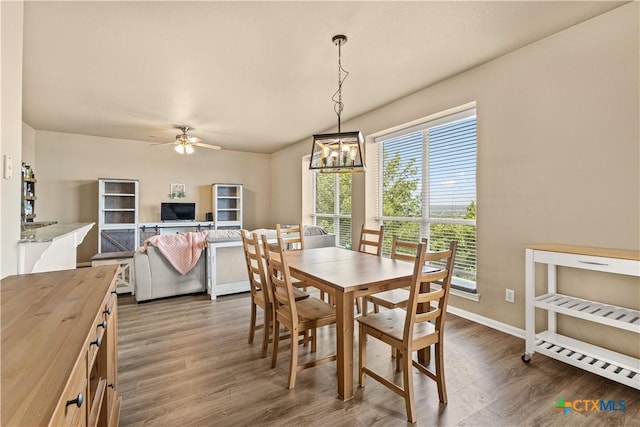 1205 Bowen Ave, Copperas Cove, TX 76522 - dining room featuring wood finished floors, ceiling fan, and baseboards