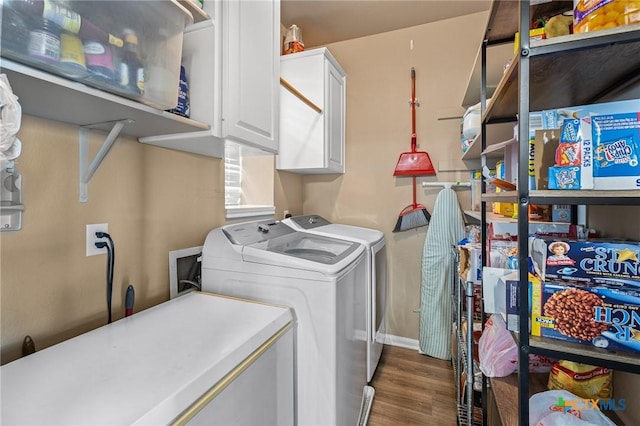 1205 Bowen Ave, Copperas Cove, TX 76522 - laundry area with washer and clothes dryer, cabinet space, wood finished floors, and baseboards