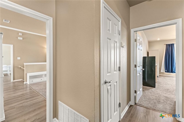 1205 Bowen Ave, Copperas Cove, TX 76522 - corridor with an upstairs landing, wood finished floors, and baseboards