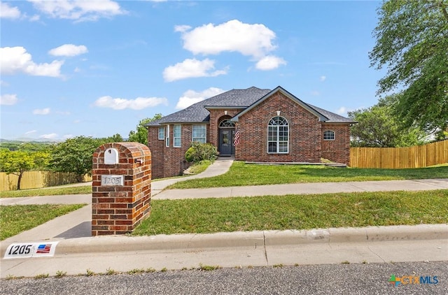 1205 Bowen Ave, Copperas Cove, TX 76522 - view of front of house featuring brick siding and roof with shingles