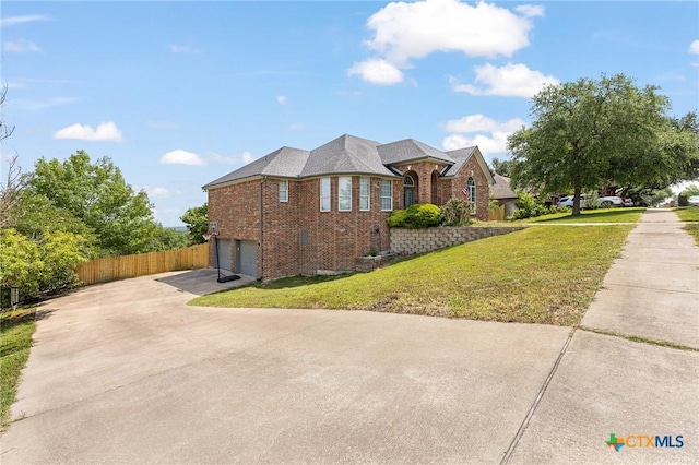 1205 Bowen Ave, Copperas Cove, TX 76522 - view of side of home featuring brick siding, a garage, and driveway