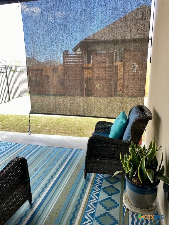 view of patio / terrace featuring fence