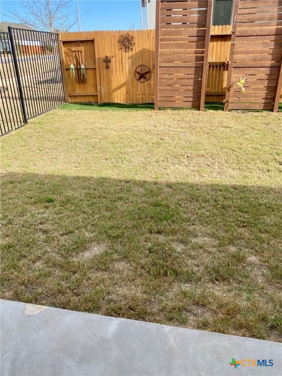 view of yard with fence