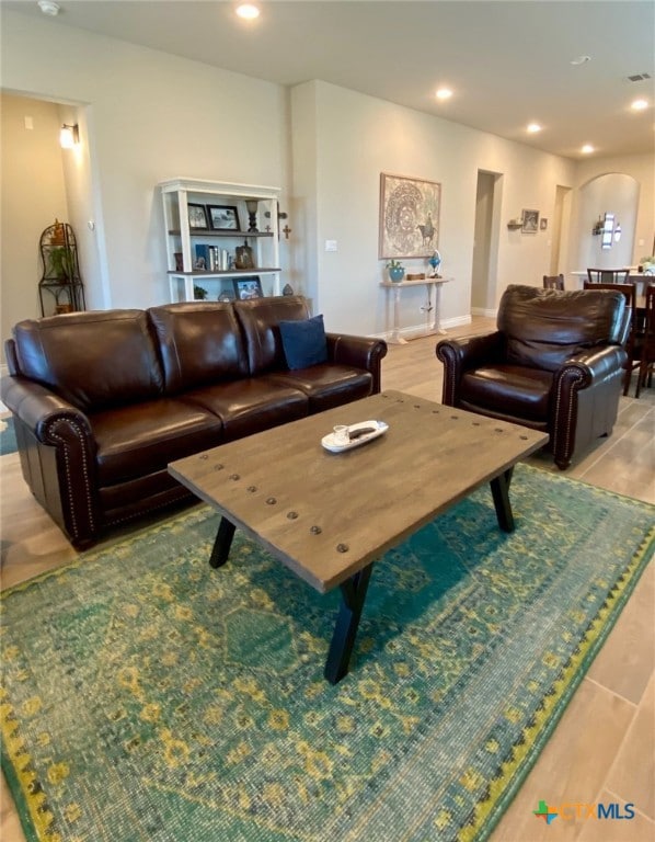 living room featuring recessed lighting and light wood-style flooring