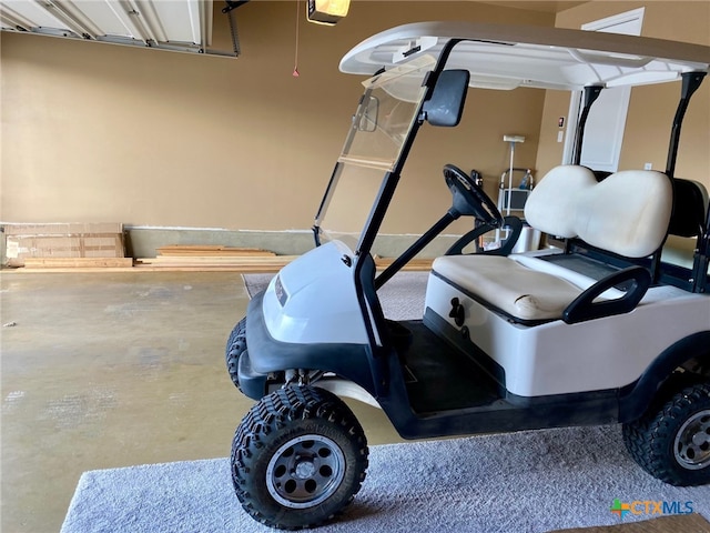 interior space featuring a garage door opener and concrete flooring