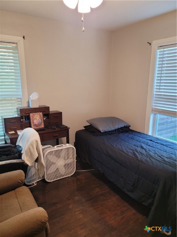 bedroom featuring dark hardwood / wood-style flooring