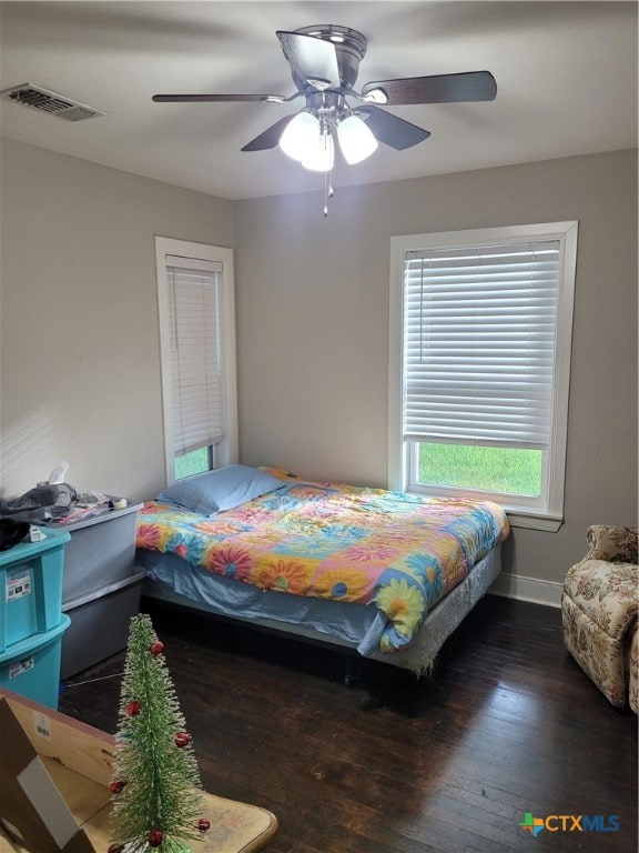 bedroom featuring dark wood-type flooring and ceiling fan