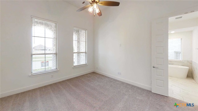 1822 Nettletree Rd, New Braunfels, TX 78132 - unfurnished room with light carpet, baseboards, and ceiling fan