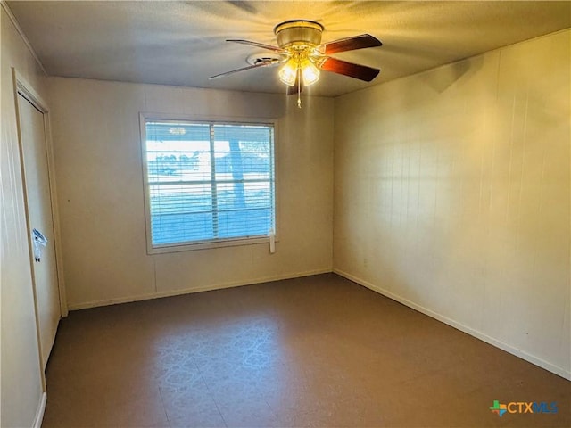 unfurnished room featuring ceiling fan