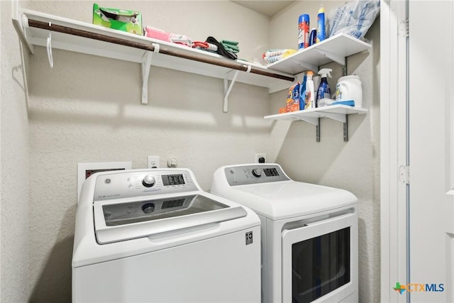 washroom with laundry area and washing machine and clothes dryer