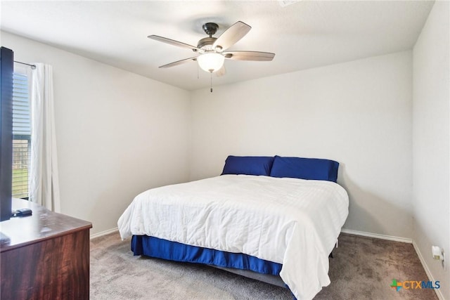 bedroom featuring carpet flooring, baseboards, and multiple windows