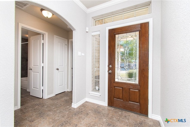 entryway with crown molding