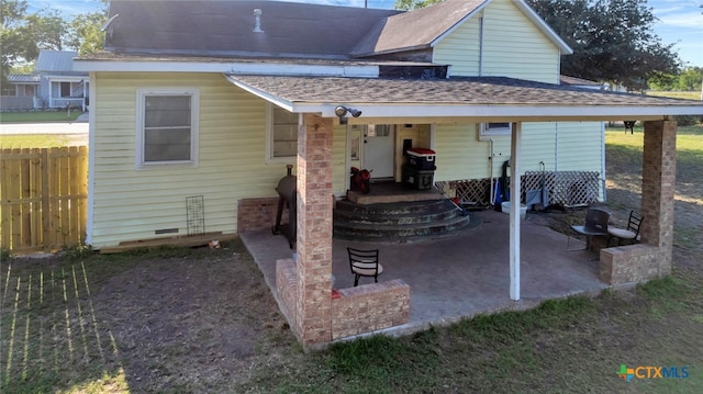 rear view of property featuring a patio area