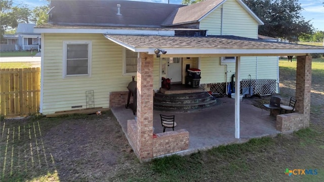 205 S Valley St, Cuero, TX 77954 - rear view of property featuring fence and a patio