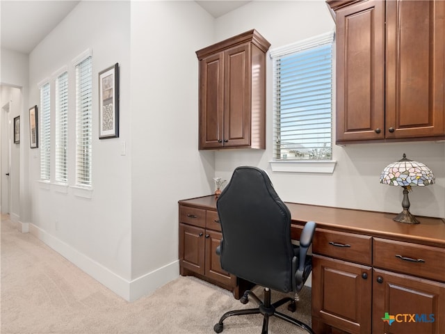 office space with light colored carpet