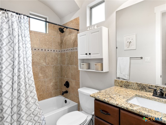 full bathroom with vanity, vaulted ceiling, toilet, and shower / bath combo with shower curtain