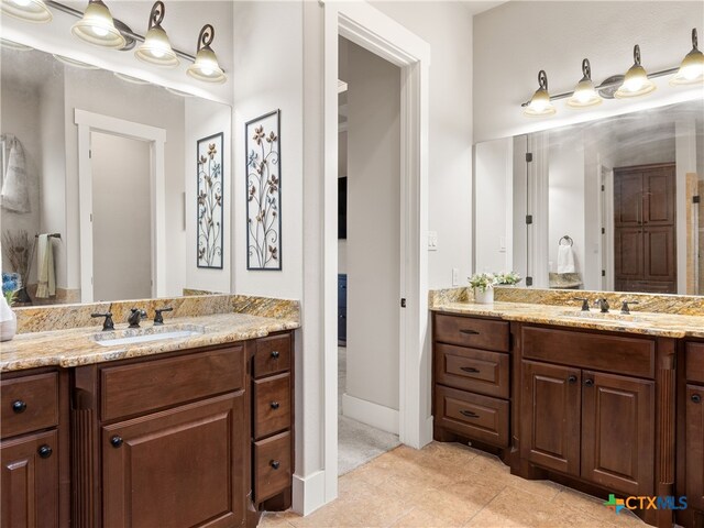 bathroom with vanity and tile patterned flooring