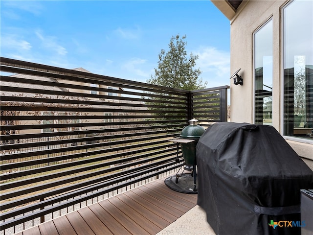 wooden deck featuring grilling area