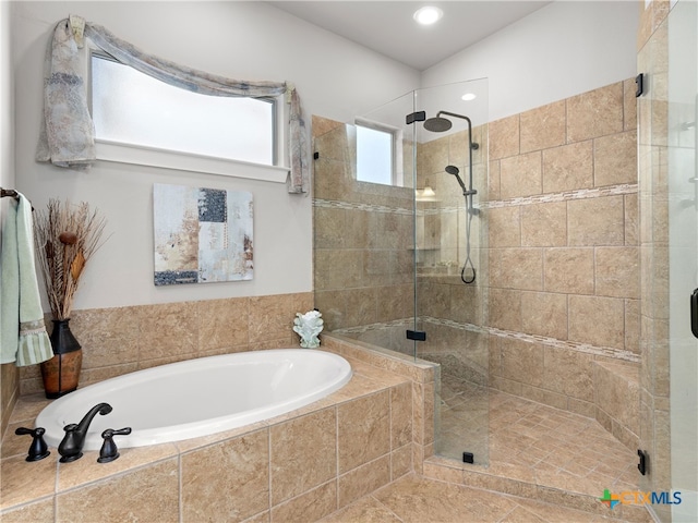 bathroom with separate shower and tub