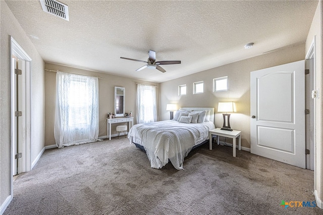 4431 Hogg, San Antonio, TX 78223 - carpeted bedroom featuring a textured ceiling and ceiling fan
