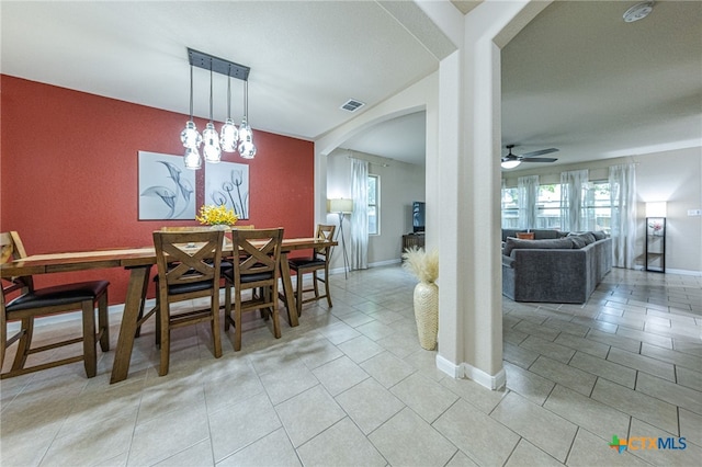 4431 Hogg, San Antonio, TX 78223 - dining room featuring arched walkways, light tile patterned floors, and ceiling fan