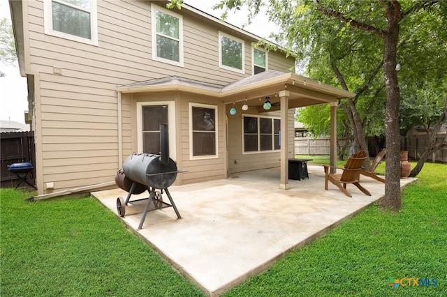4431 Hogg, San Antonio, TX 78223 - back of house featuring a fenced backyard, a patio, a ceiling fan, and an outdoor fire pit