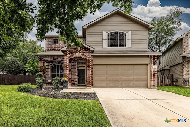 4431 Hogg, San Antonio, TX 78223 - traditional home featuring brick siding, an attached garage, and driveway