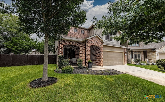 4431 Hogg, San Antonio, TX 78223 - view of front of house with concrete driveway, brick siding, and a garage
