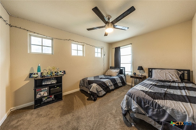 4431 Hogg, San Antonio, TX 78223 - carpeted bedroom featuring baseboards and ceiling fan