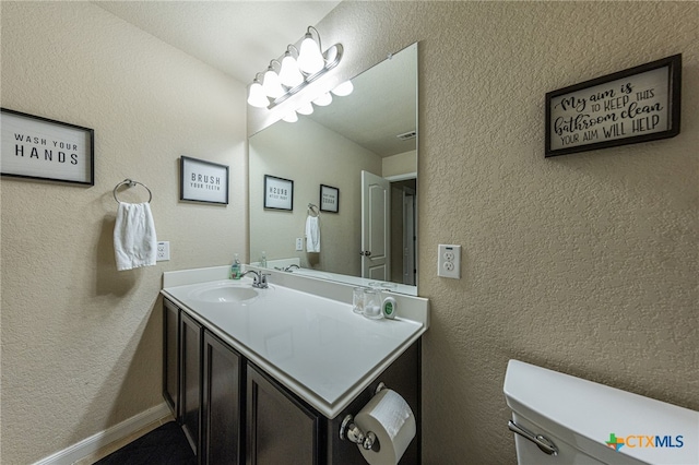 4431 Hogg, San Antonio, TX 78223 - half bathroom featuring vanity and a textured wall
