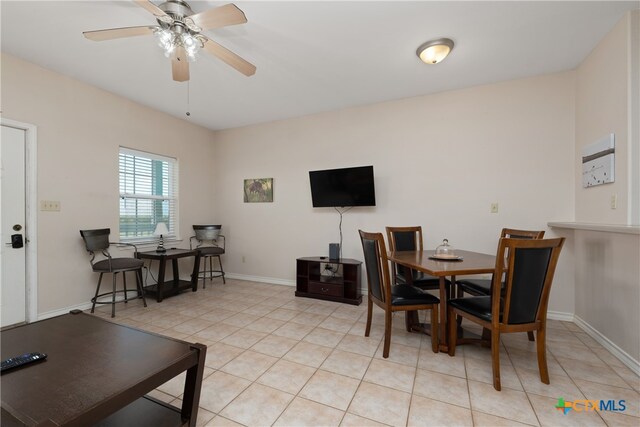 dining area with ceiling fan and light tile patterned floors