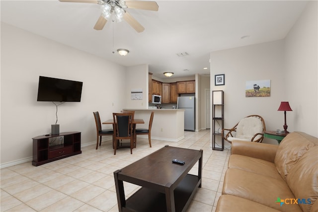 living room featuring ceiling fan and light tile patterned floors