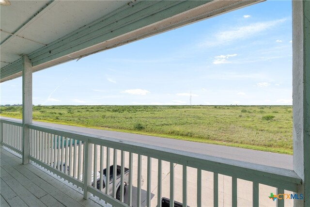 balcony featuring a rural view