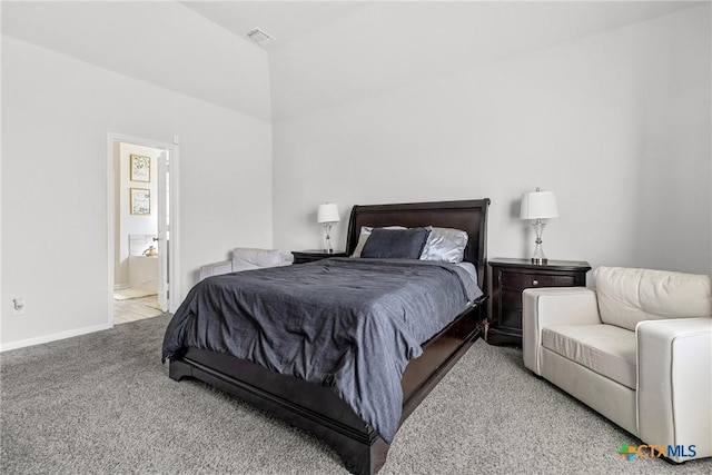 bedroom featuring visible vents, ensuite bath, baseboards, and carpet floors