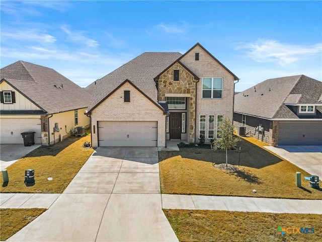 view of front of home featuring central air condition unit, driveway, brick siding, and a front lawn