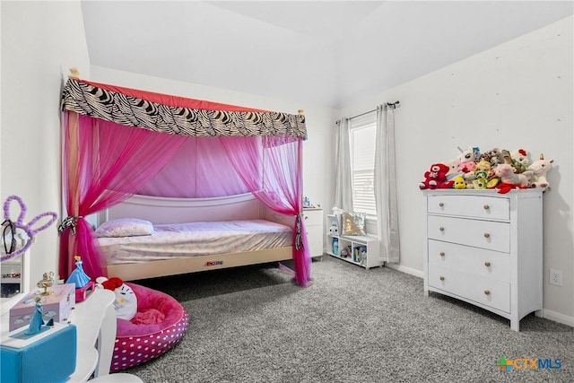 carpeted bedroom with lofted ceiling and baseboards