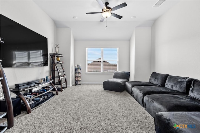 carpeted living room featuring visible vents, baseboards, ceiling fan, and vaulted ceiling